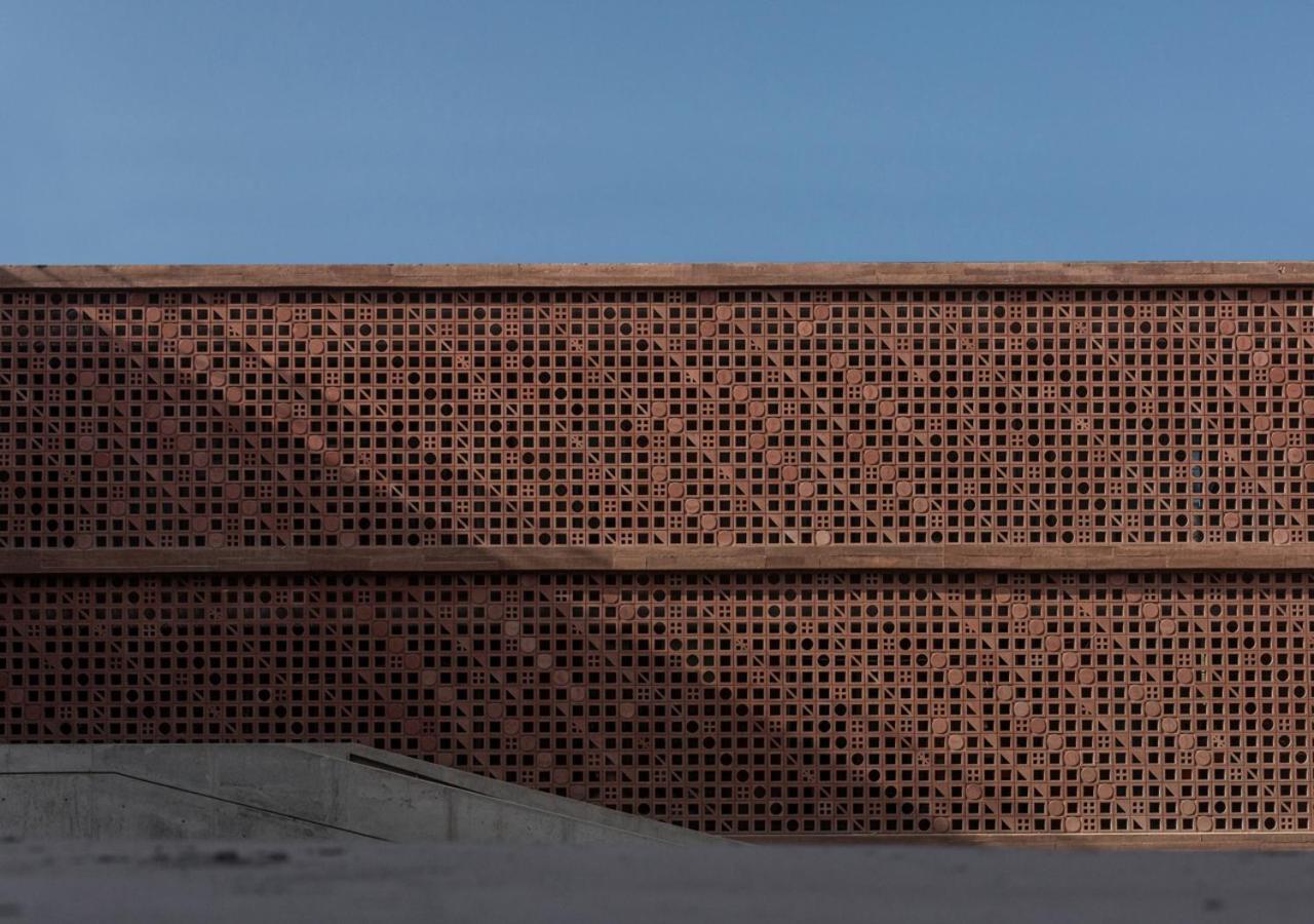 Potato Head Suites & Studios Семиньяк Экстерьер фото The perforated brick facade